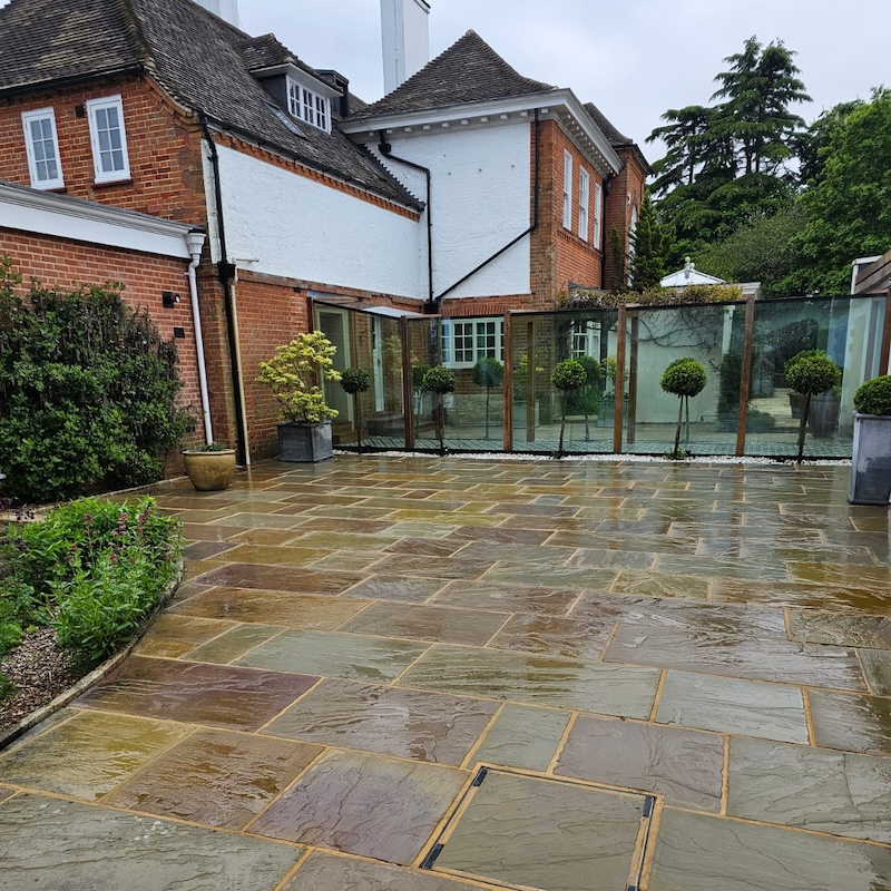 Freshly power washed garden slabs in Higginson